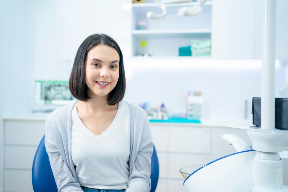 Patient smiling after a routine dental cleaning and exam